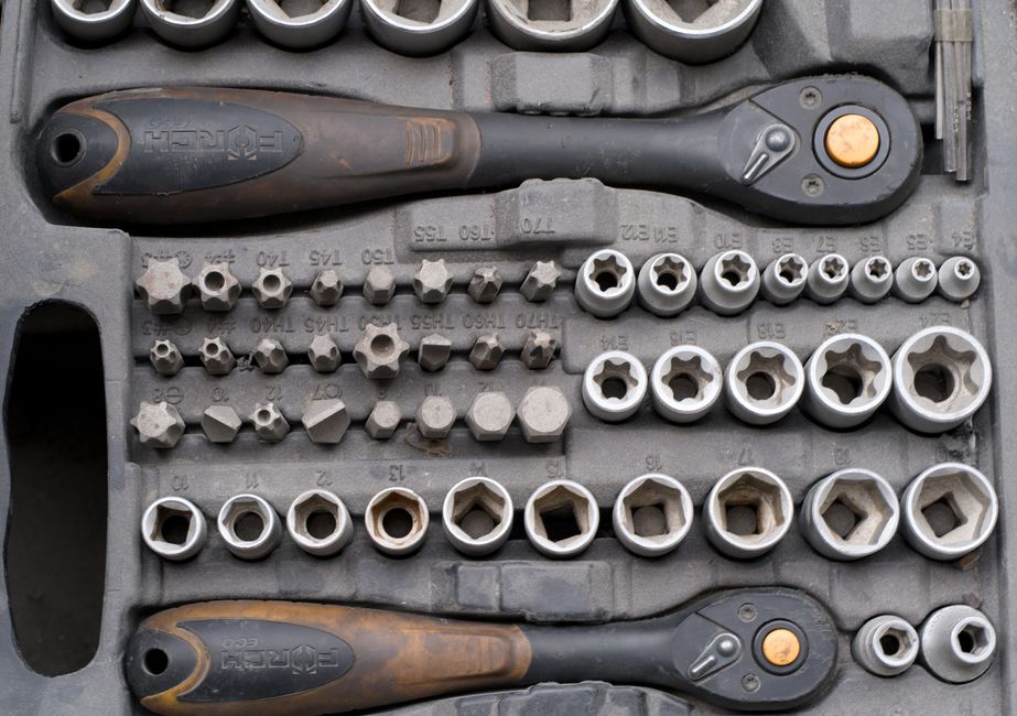 A detailed socket ratchet set with various attachments ideal for mechanical repairs.